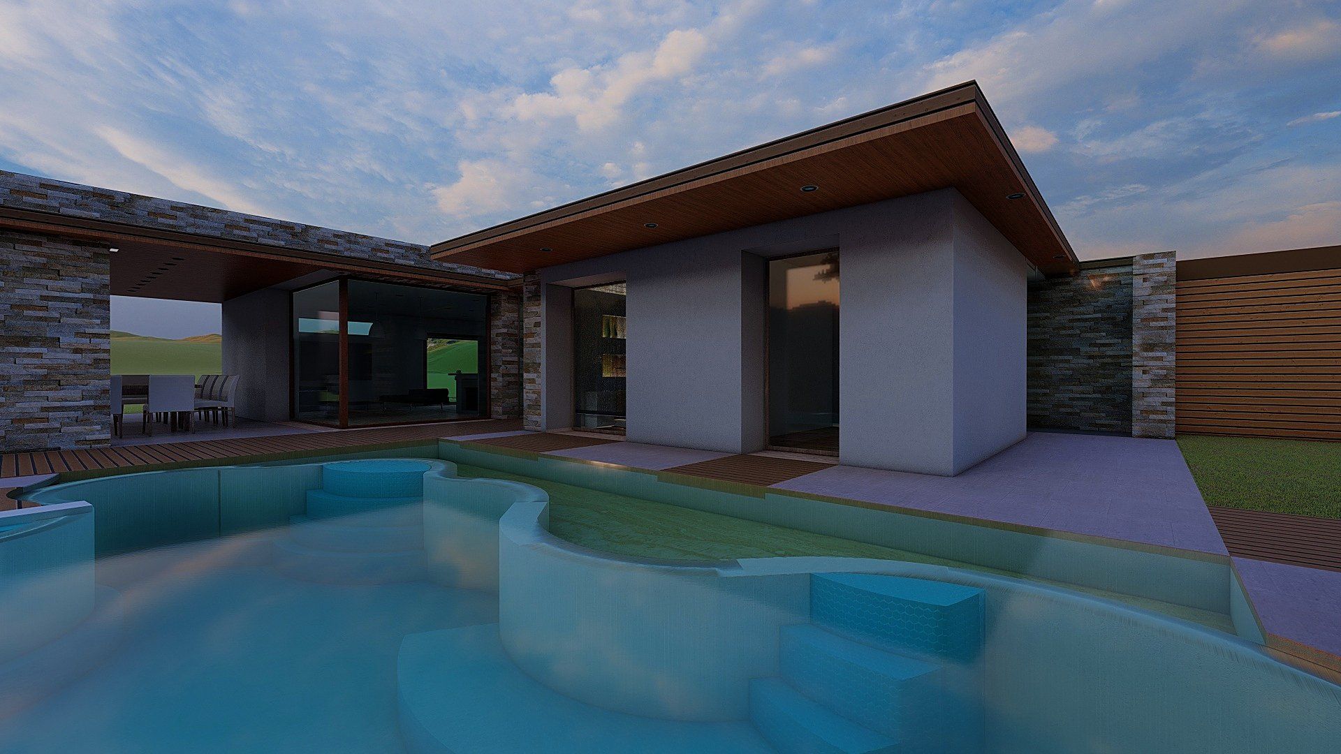 La piscina al tramonto, con i muri di pietra e le vetrate della villa illuminate
