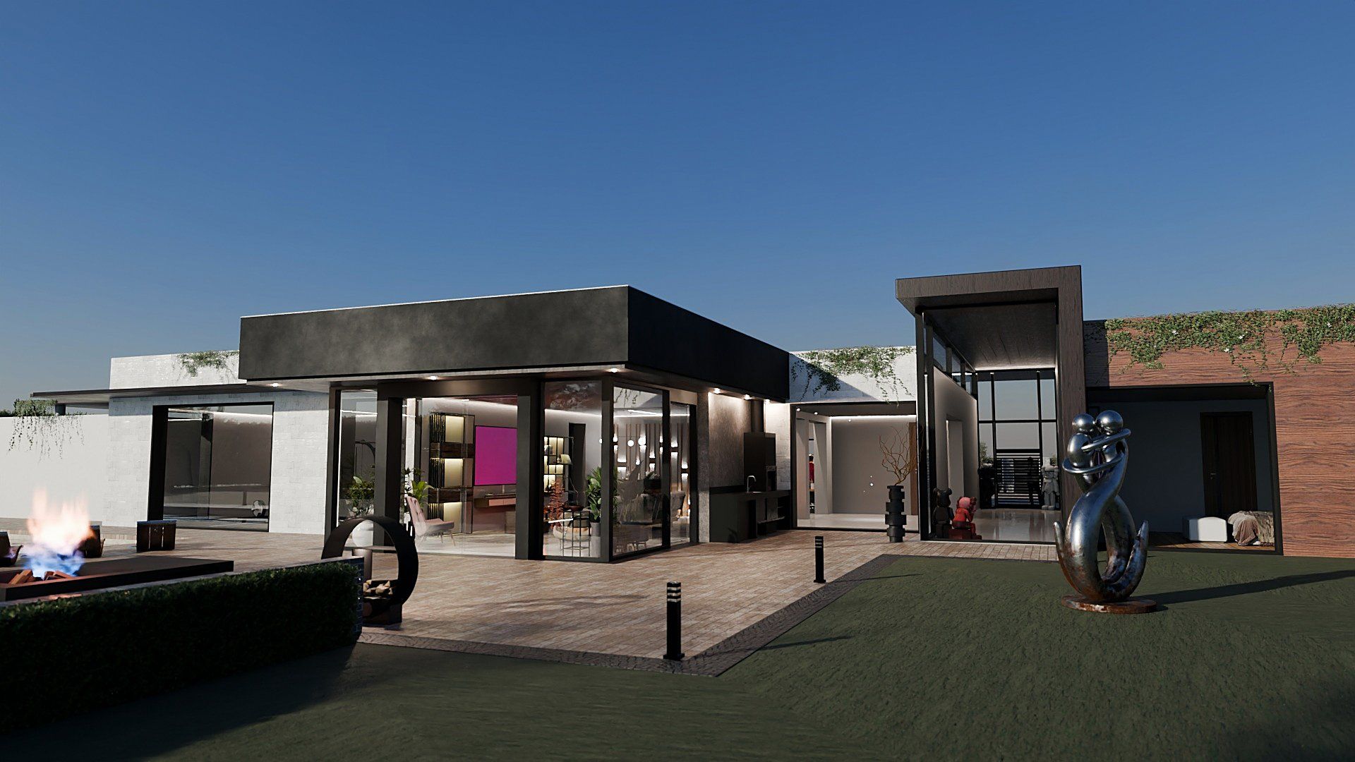 The patio at sunset: the glass living room beneath the dark roof, the wooden entrance portal and the sculpture on the lawn