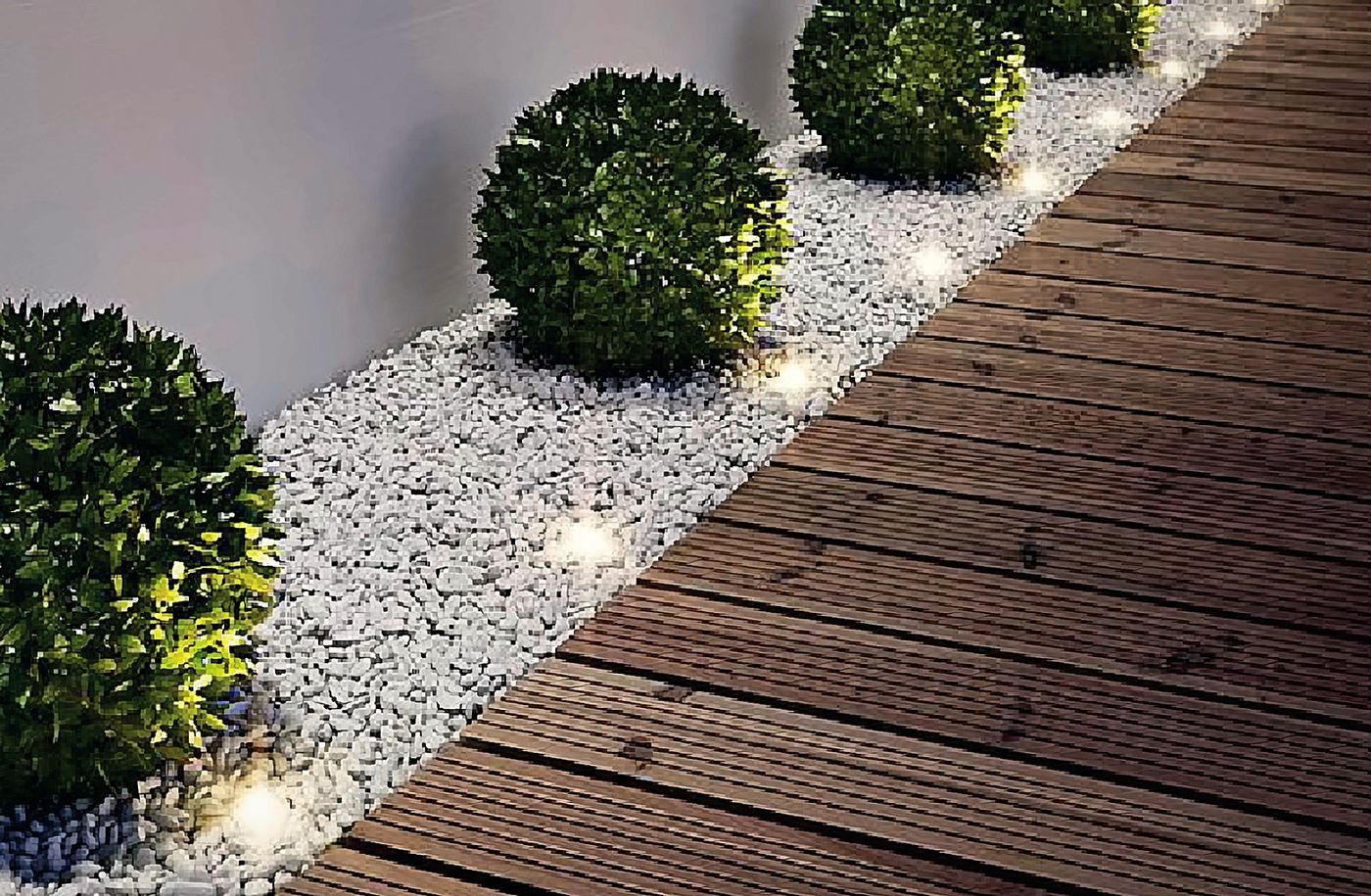 Wooden decking, gravel and lit box spheres