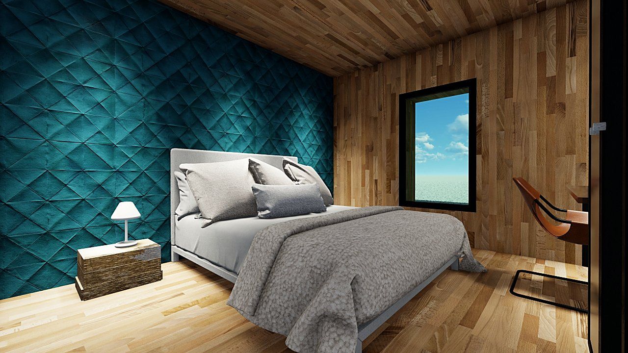 La camera rivestita in legno, con la parete imbottita verde ottanio dietro il letto