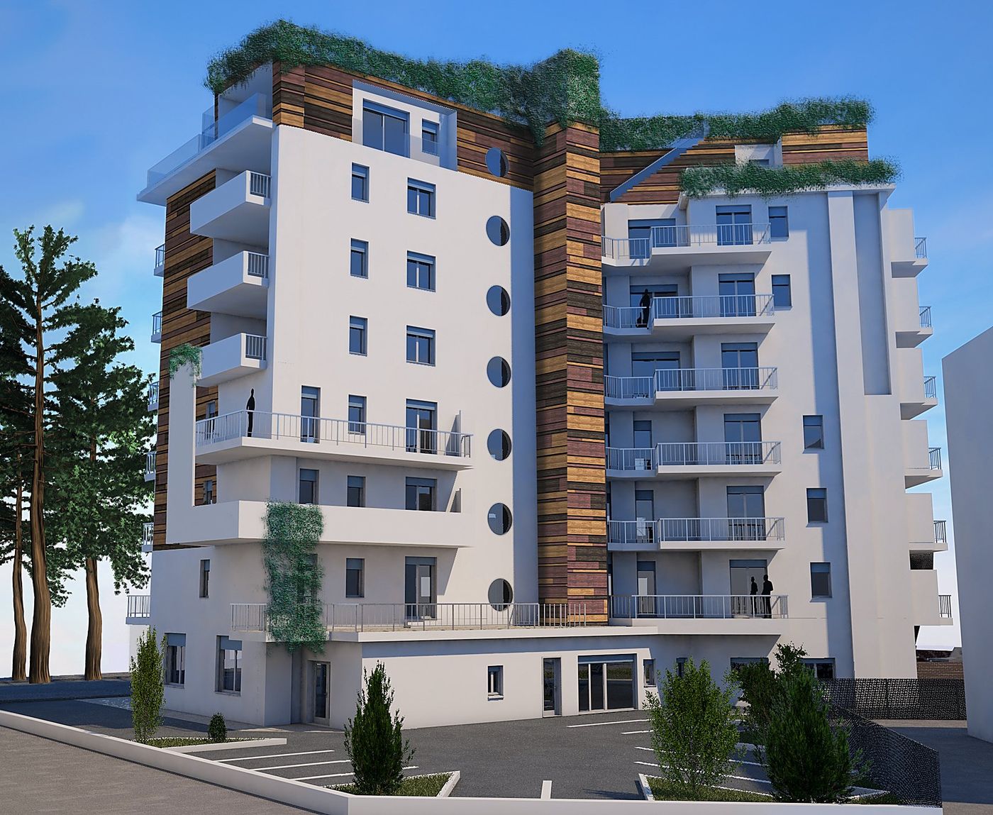 Condominio Bali: lo spigolo rivestito in legno con le finestre tonde, i terrazzi e il verde di copertura