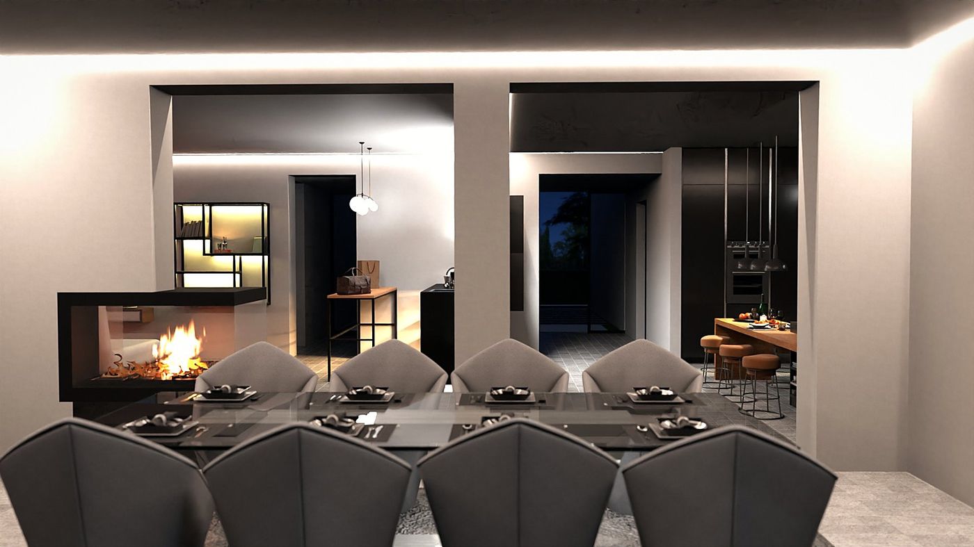 The dining table, the open fireplace and the kitchen at the far end